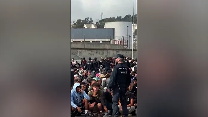 Police transfer migrants from Ceuta beaches to temporary port camp Police transfer migrants from Ceuta beaches to temporary port camp
