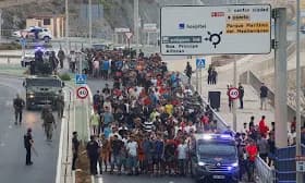 Thousands of migrants surge into Spanish enclave Ceuta as crisis escalates Thousands of migrants surge into Spanish enclave Ceuta as crisis escalates
